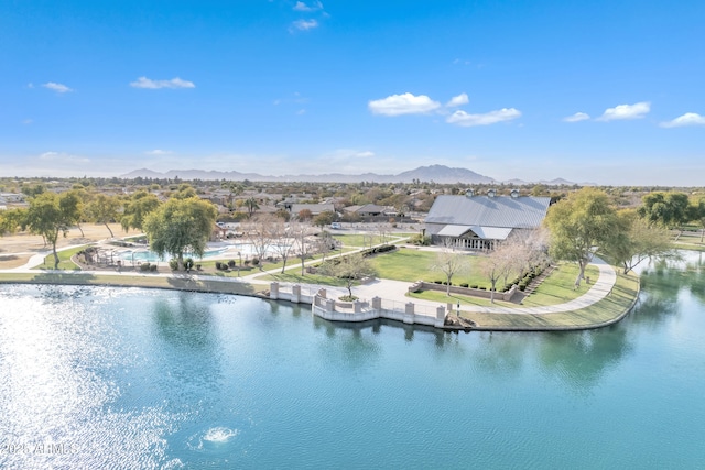 drone / aerial view featuring a water and mountain view