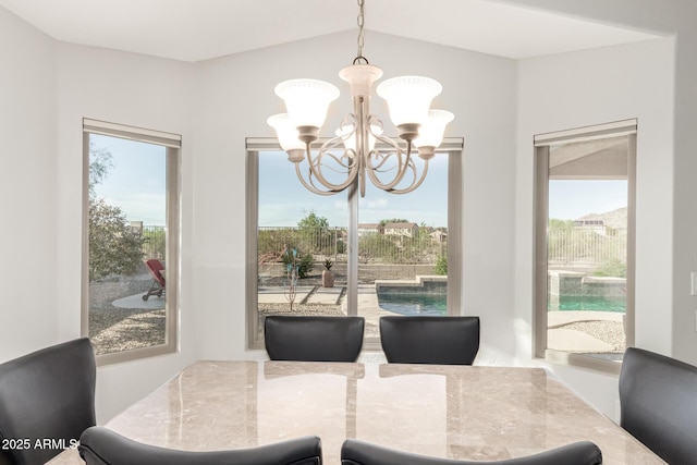 17562 W Desert Sage Dr, Goodyear, AZ 85338 - dining space featuring a chandelier and vaulted ceiling