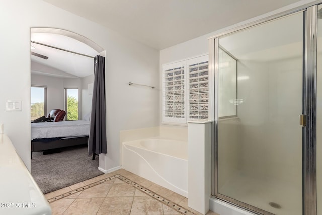 17562 W Desert Sage Dr, Goodyear, AZ 85338 - ensuite bathroom with a garden tub, a stall shower, vaulted ceiling, and tile patterned flooring