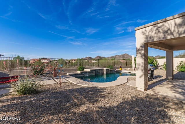 17562 W Desert Sage Dr, Goodyear, AZ 85338 - view of swimming pool featuring a fenced backyard, a patio area, and a mountain view