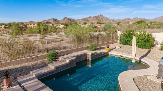17562 W Desert Sage Dr, Goodyear, AZ 85338 - view of pool with a mountain view and a fenced backyard