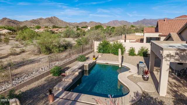 17562 W Desert Sage Dr, Goodyear, AZ 85338 - view of pool featuring a mountain view, a fenced backyard, and a patio area