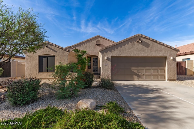 17562 W Desert Sage Dr, Goodyear, AZ 85338 - view of front of home featuring a garage, stucco siding, concrete driveway, and a tile roof