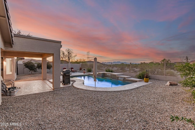 17562 W Desert Sage Dr, Goodyear, AZ 85338 - view of swimming pool featuring a patio, a fenced backyard, and a grill