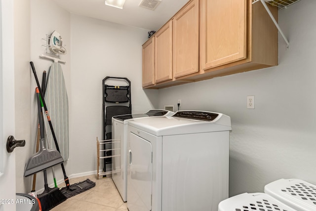 17562 W Desert Sage Dr, Goodyear, AZ 85338 - laundry area with separate washer and dryer, cabinet space, light tile patterned floors, and baseboards
