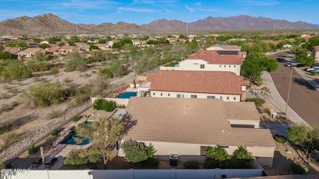 17562 W Desert Sage Dr, Goodyear, AZ 85338 - aerial view of residential area with a pool and a mountainous background