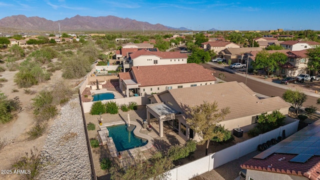 17562 W Desert Sage Dr, Goodyear, AZ 85338 - aerial view of residential area featuring a pool area and a mountainous background