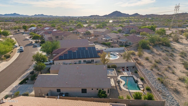 17562 W Desert Sage Dr, Goodyear, AZ 85338 - view of property location featuring a pool, mountains, and nearby suburban area