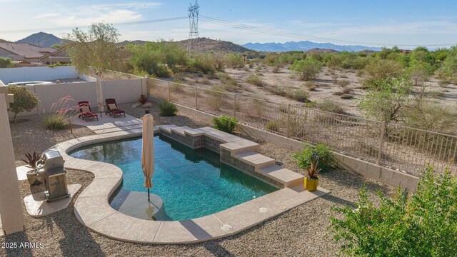 17562 W Desert Sage Dr, Goodyear, AZ 85338 - view of pool with a mountain view, a fenced backyard, and a patio