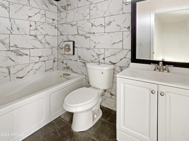 full bathroom featuring washtub / shower combination, vanity, toilet, and tile walls