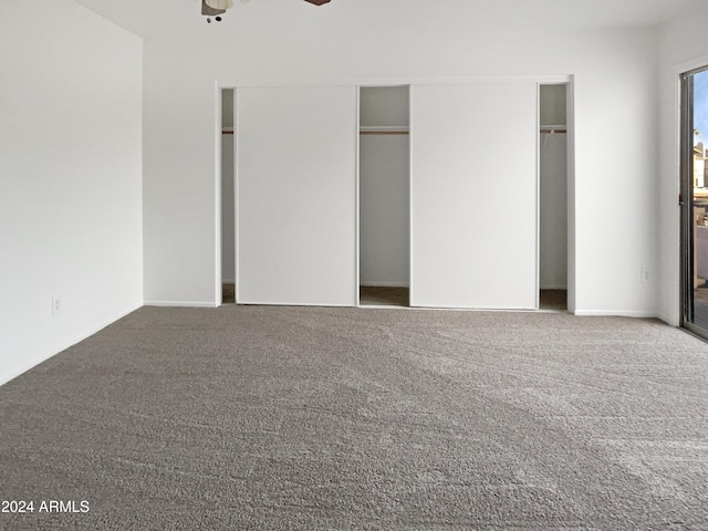 unfurnished bedroom featuring ceiling fan and carpet floors