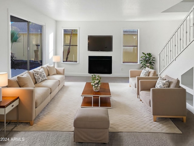 living room with light carpet and plenty of natural light