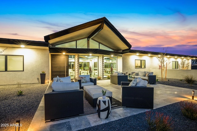 patio terrace at dusk with an outdoor hangout area