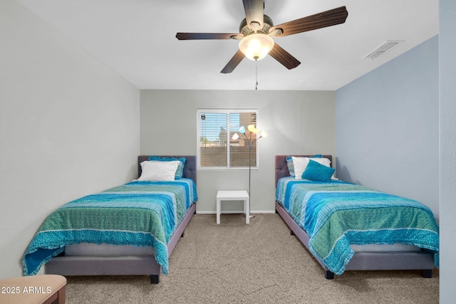 bedroom featuring baseboards, carpet, visible vents, and ceiling fan