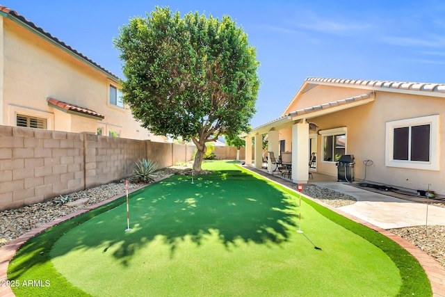 view of yard featuring a fenced backyard and a patio area