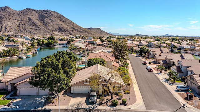 aerial view featuring a residential view and a water and mountain view