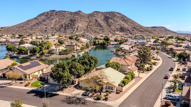 aerial view with a residential view and a water and mountain view