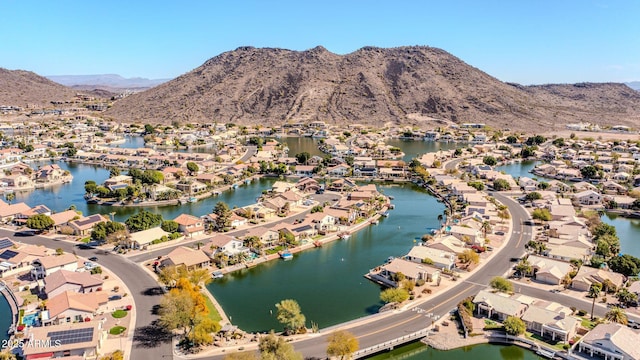 bird's eye view featuring a residential view and a water and mountain view