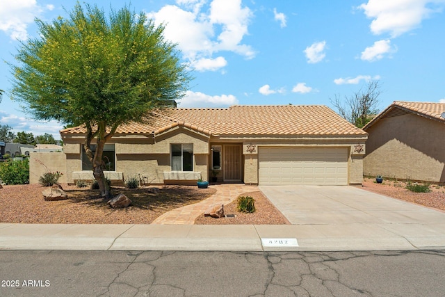 4202 E Brookwood Ct, Phoenix, AZ 85048 - view of front of property featuring an attached garage, concrete driveway, a tile roof, and stucco siding