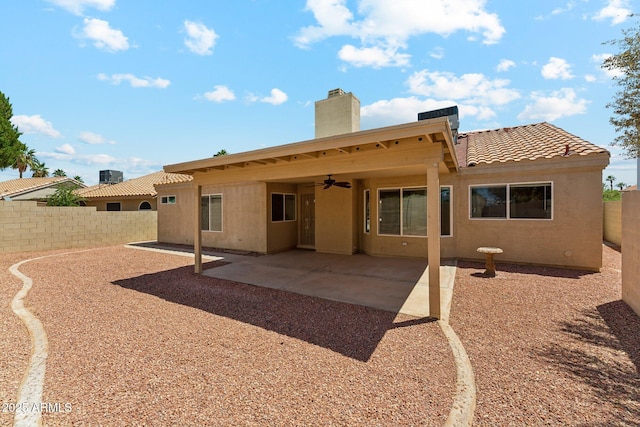 4202 E Brookwood Ct, Phoenix, AZ 85048 - rear view of property featuring ceiling fan, a fenced backyard, a patio, a chimney, and a tiled roof