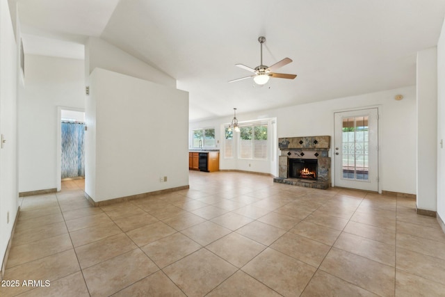 4202 E Brookwood Ct, Phoenix, AZ 85048 - unfurnished living room featuring light tile patterned floors, lofted ceiling, a ceiling fan, a fireplace, and baseboards