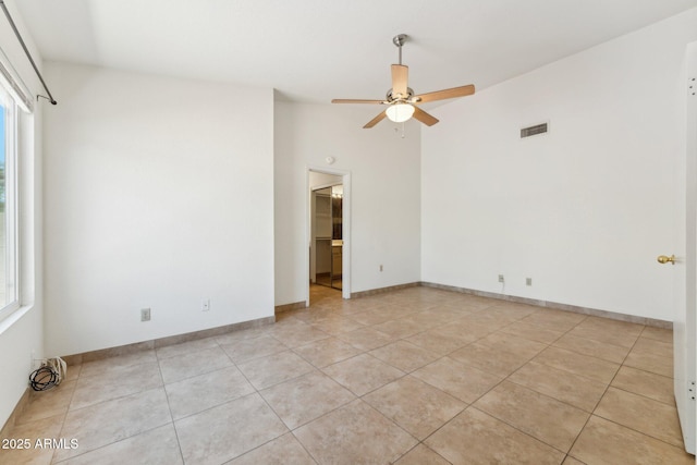 4202 E Brookwood Ct, Phoenix, AZ 85048 - unfurnished room featuring ceiling fan, light tile patterned floors, healthy amount of natural light, and lofted ceiling