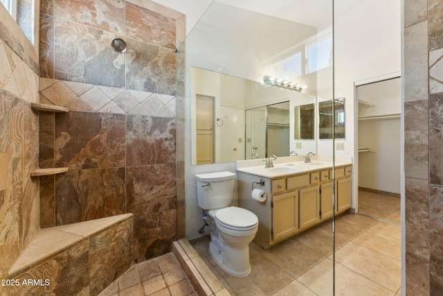 4202 E Brookwood Ct, Phoenix, AZ 85048 - bathroom featuring walk in shower, toilet, double vanity, tile patterned floors, and a high ceiling