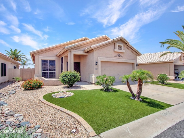 11547 W King Snake Ct, Surprise, AZ 85378 - view of front of home with stucco siding, a garage, concrete driveway, and a tile roof