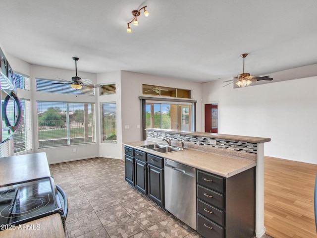 11547 W King Snake Ct, Surprise, AZ 85378 - kitchen with dishwasher, ceiling fan, a sink, electric range oven, and light countertops