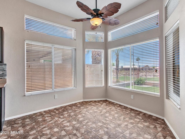 11547 W King Snake Ct, Surprise, AZ 85378 - unfurnished sunroom featuring baseboards