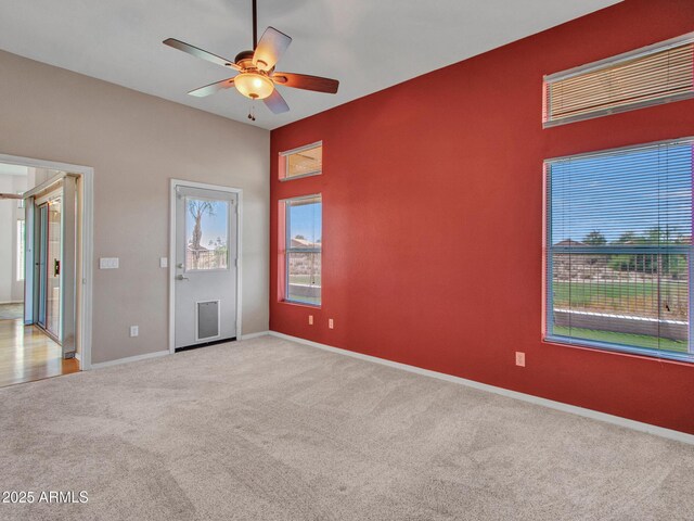 11547 W King Snake Ct, Surprise, AZ 85378 - unfurnished bedroom featuring carpet flooring, baseboards, and ceiling fan