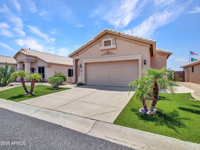 11547 W King Snake Ct, Surprise, AZ 85378 - view of front facade featuring stucco siding, driveway, an attached garage, and a tiled roof
