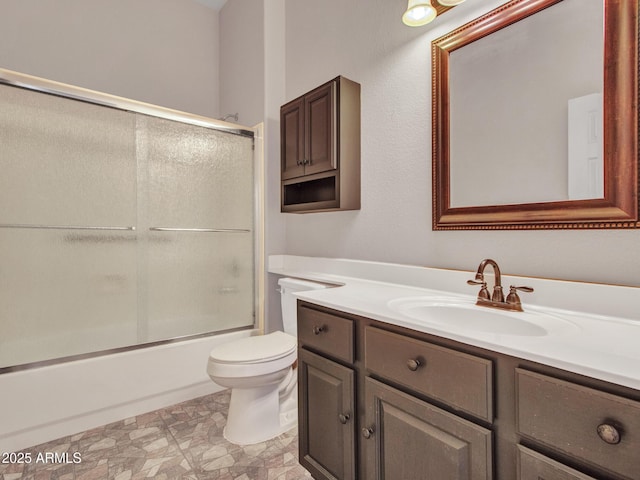 11547 W King Snake Ct, Surprise, AZ 85378 - bathroom featuring vanity, toilet, and combined bath / shower with glass door