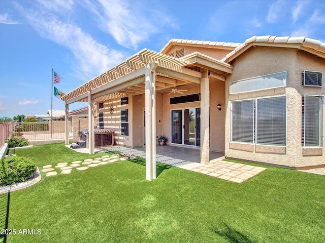 11547 W King Snake Ct, Surprise, AZ 85378 - back of property featuring a ceiling fan, a patio area, stucco siding, and a pergola