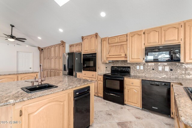 kitchen featuring premium range hood, sink, backsplash, black appliances, and light brown cabinets