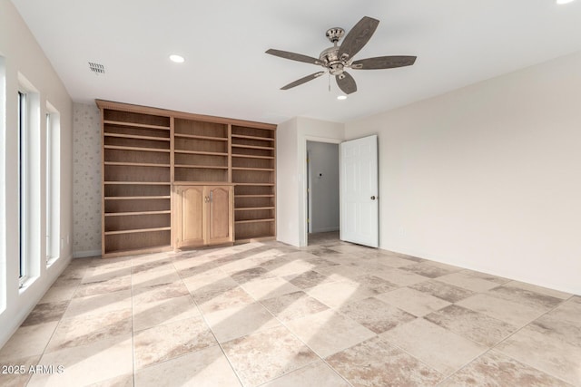 unfurnished bedroom featuring ceiling fan