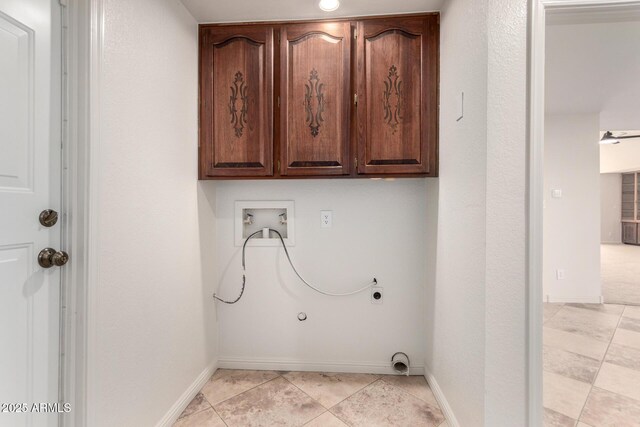 laundry room with gas dryer hookup, cabinets, light tile patterned floors, hookup for a washing machine, and electric dryer hookup