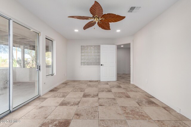 unfurnished room featuring ceiling fan