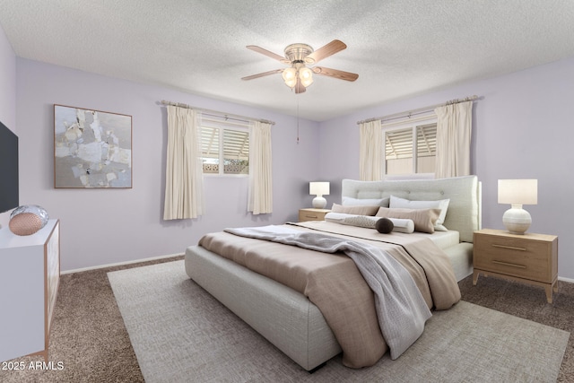 bedroom with a textured ceiling, carpet floors, a ceiling fan, and baseboards