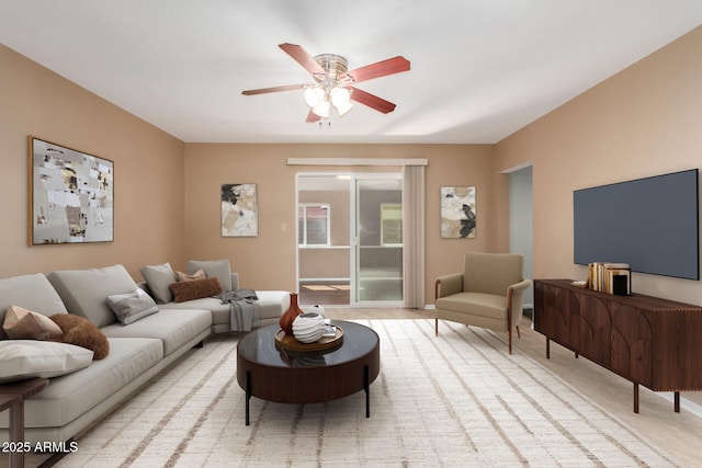 living room featuring a ceiling fan