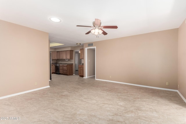 unfurnished living room featuring baseboards, visible vents, and a ceiling fan