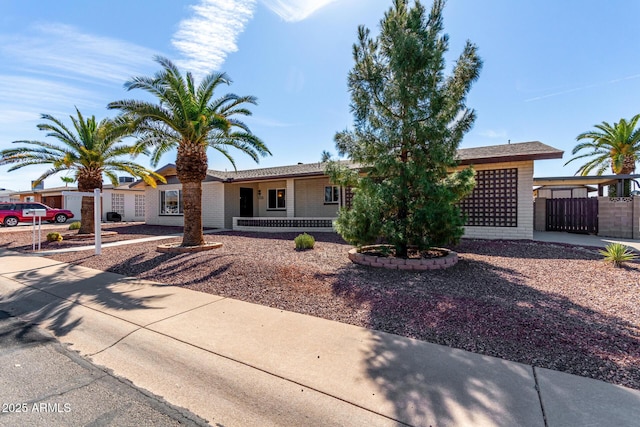 single story home with fence