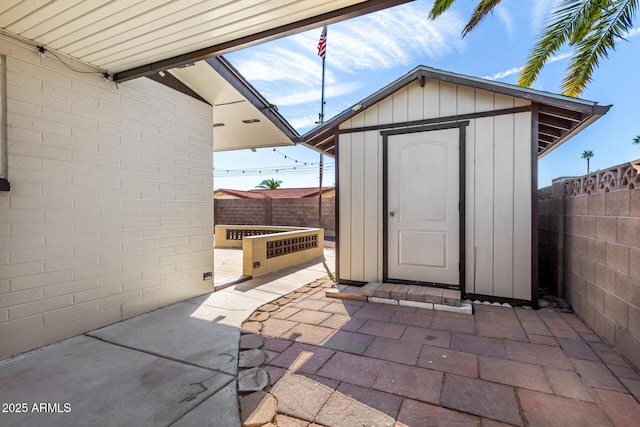 view of shed featuring a fenced backyard