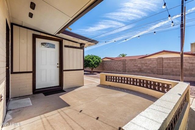 view of patio / terrace featuring fence