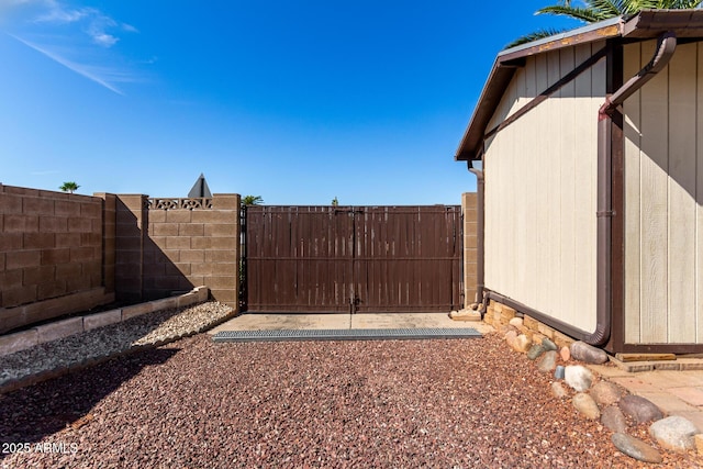 view of gate with fence