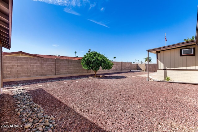 view of yard with a fenced backyard