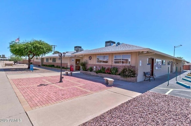 single story home with central air condition unit