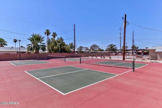 view of sport court featuring community basketball court and fence