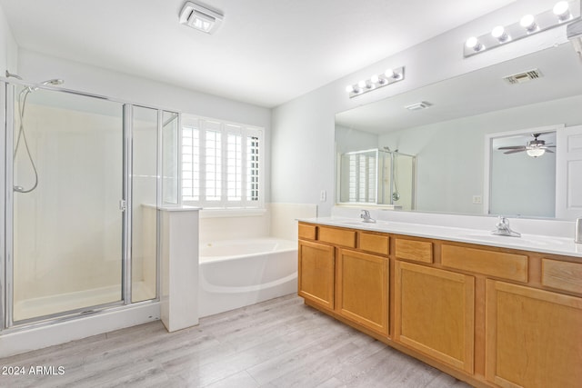 bathroom featuring vanity, hardwood / wood-style floors, shower with separate bathtub, and ceiling fan