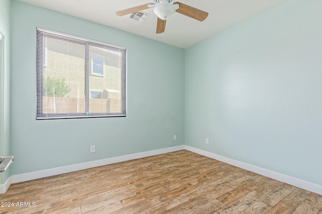 spare room featuring ceiling fan and light wood-type flooring